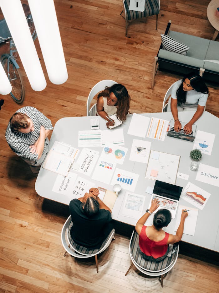 High-Angle Shot of Five People Working in the Office